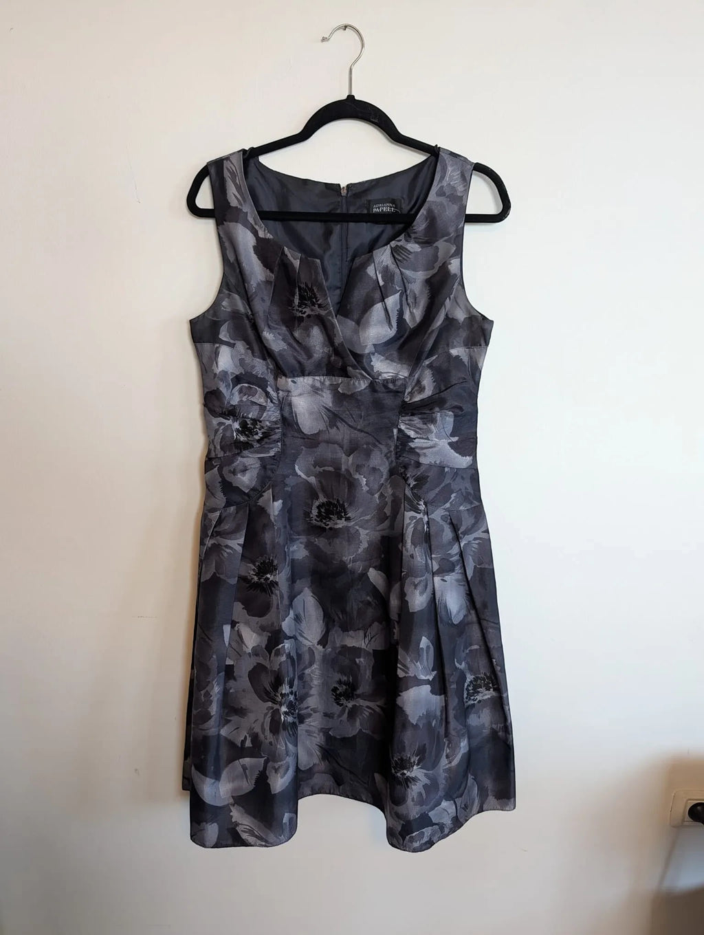 Nu-Nv Clothing sleeveless midi dress in charcoal and grey floral print with a structured bodice and pleated waist.