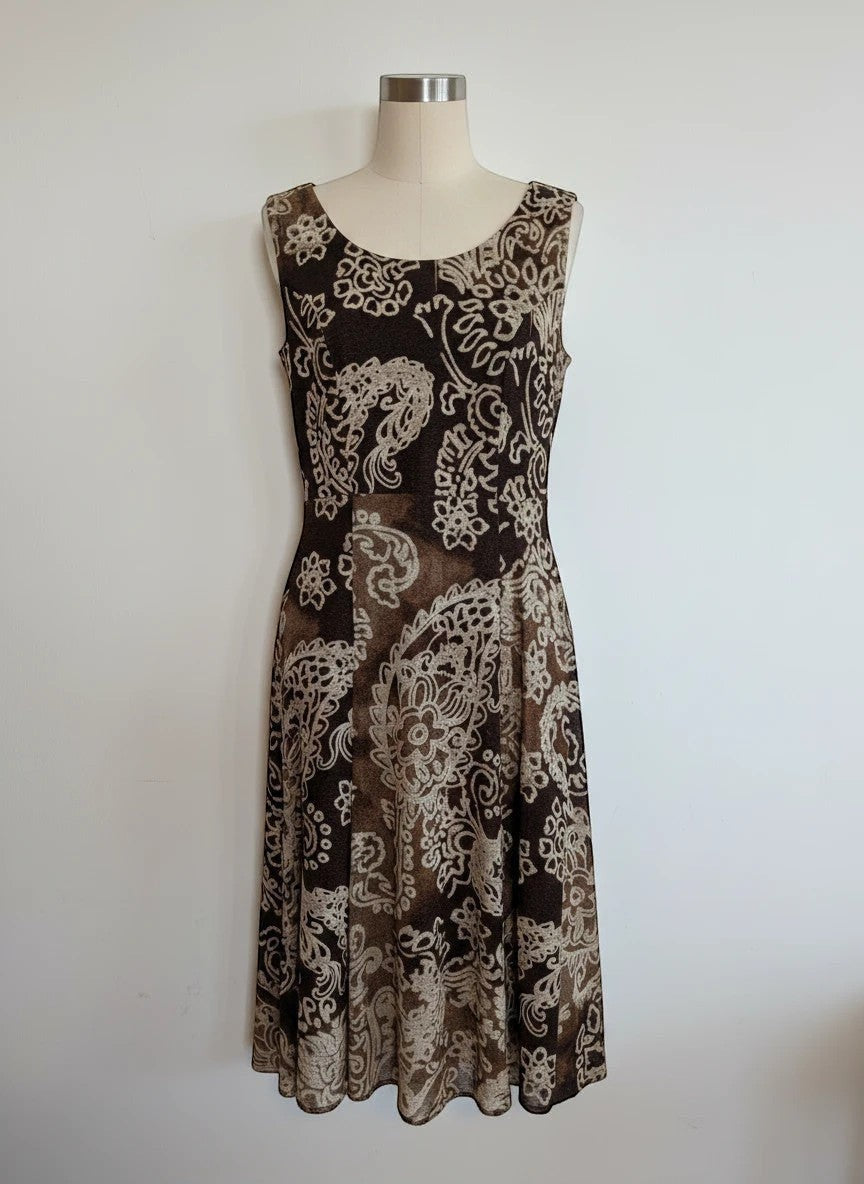 Nu-Nv Clothing sleeveless brown fit and flare dress with cream paisley print and scoop neckline on a mannequin.